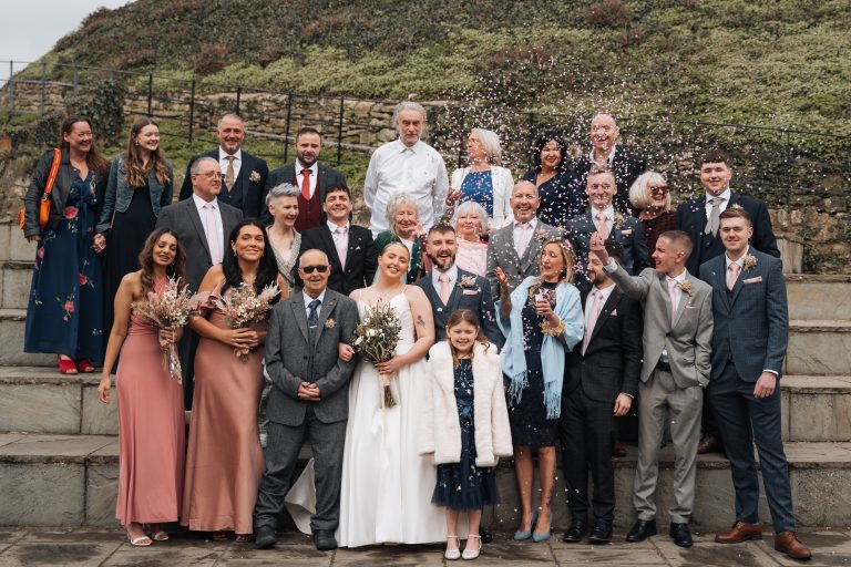 Group photo from a wedding with all of the family and friends.