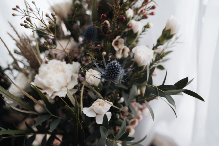 Wedding flowers, with a close up of a blue thistle