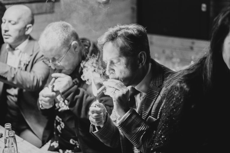 A man lighting a cigar