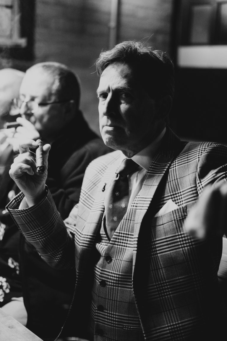 A man posing with a cigar