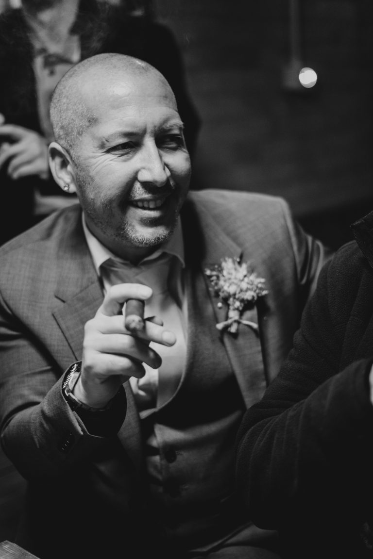 A man holding a cigar