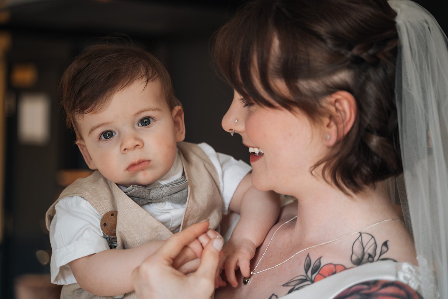 Bride looking at her young son
